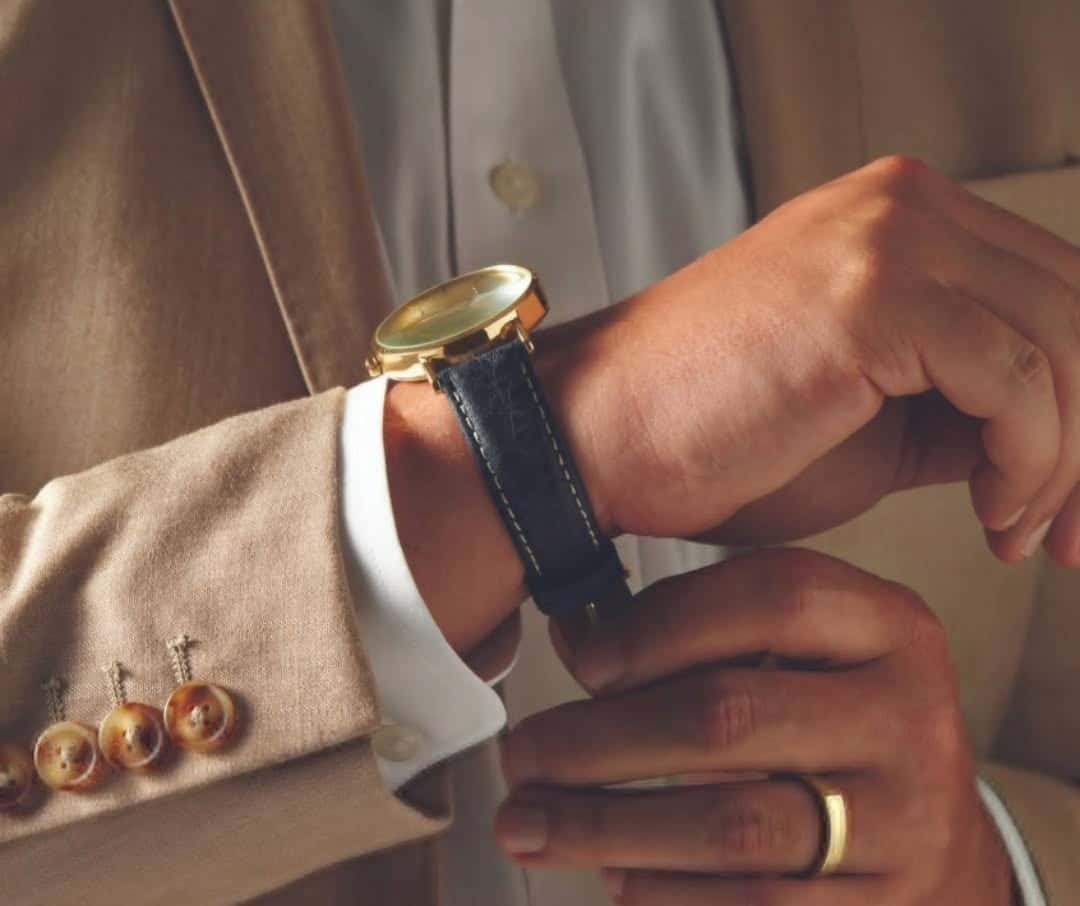 jeweler replacing watch battery with precision tools
